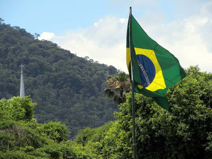 From Rio: Full-Day Tour to The Imperial City of Petrópolis - Tropical tree-lined streets, a shopping window, and Santos Dumont relics