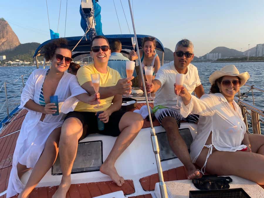 Rio de Janeiro: Sunset Sailboat Tour with Open Bar - Crew, music, and photo help from hosts like Paola and Mariana